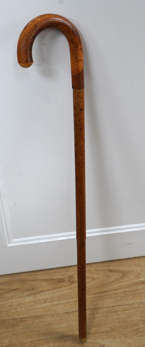 An early 20th century metamorphic walking stick, containing an aluminium camera tripod, 89cm long. Condition - good